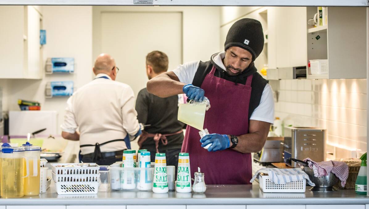 Sia Soliola volunteers his time on a regular basis to work serving breakfasts at a Canberra soup kitchen. Picture: Karleen Minney.