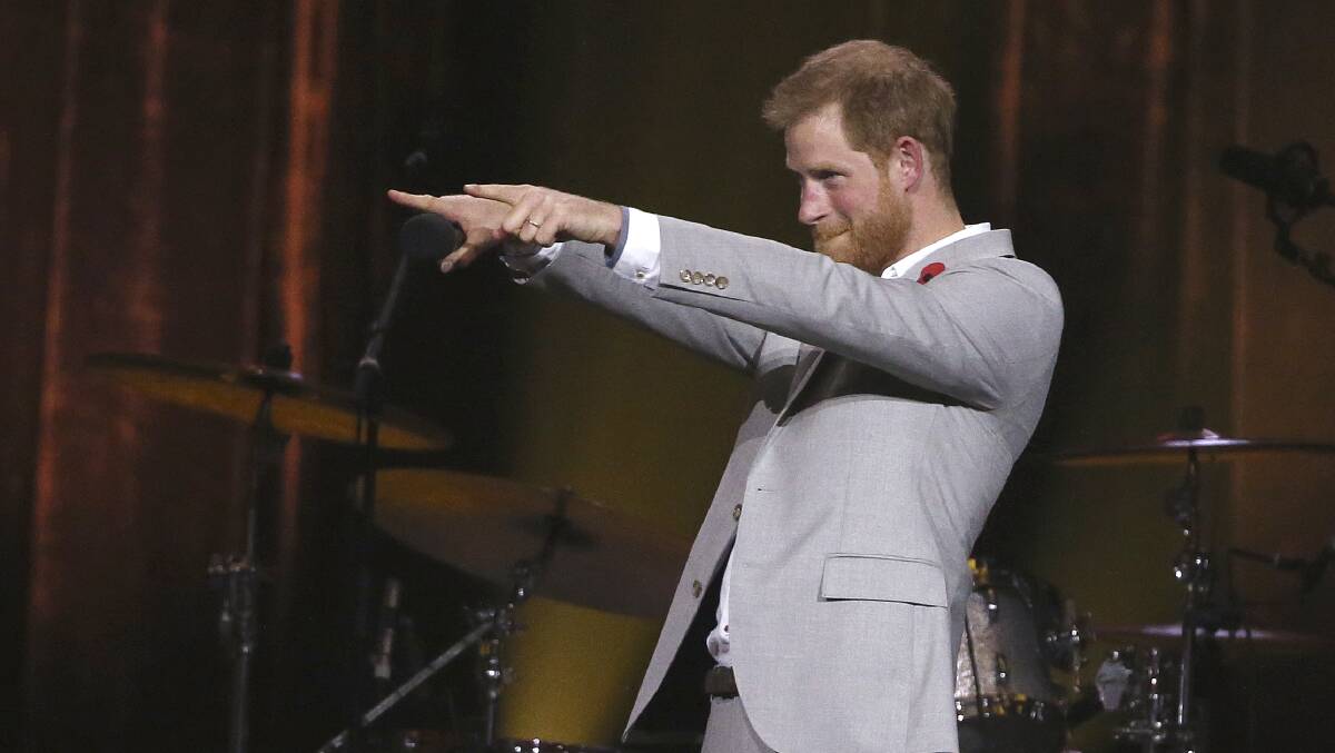 Prince Harry on the verge of a mic drop during his closing speech at the Invictus Games in Sydney last year. Millennial public speaking styles, in spades. Photo: AP