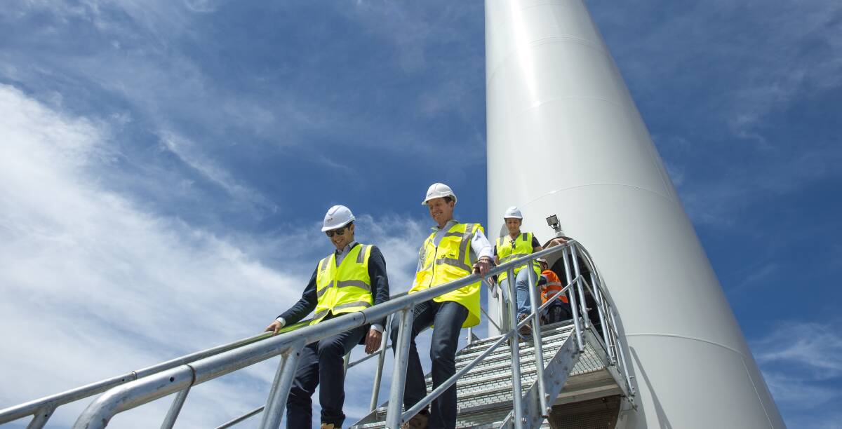 Greens leader Shane Rattenbury, centre, inspects a wind turbine at Crookwell 2 wind farm as climate change minister. Photo: Sitthixay Ditthavong