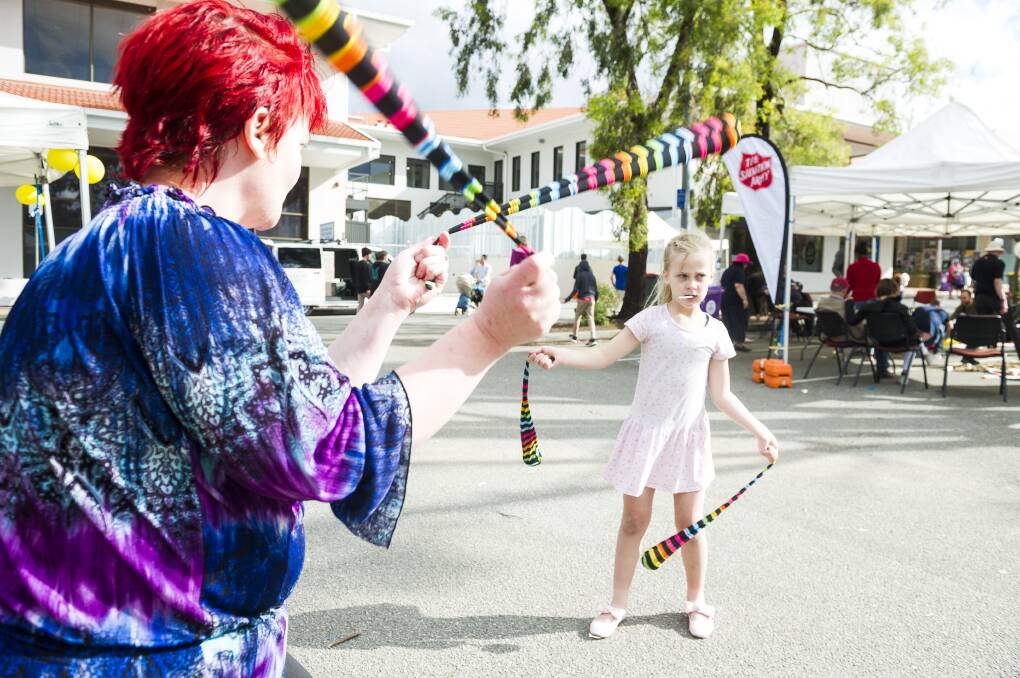 Trish Reeve teaching her daughter Lizzie Reeve, 8, poi spinning at last year's SouthFest .Picture: Dion Georgopoulos