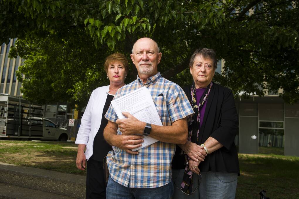 Bonython resident Nev Sheather (centre) has mixed views on a new proposal to give the states and territories the power to regulate drone noise. Picture: Dion Georgopoulos