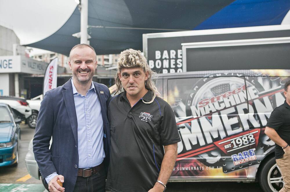 In better times, Summernats co-owner Andy Lopez hams it up in a blond mullet with Chief Minister Andrew Barr.