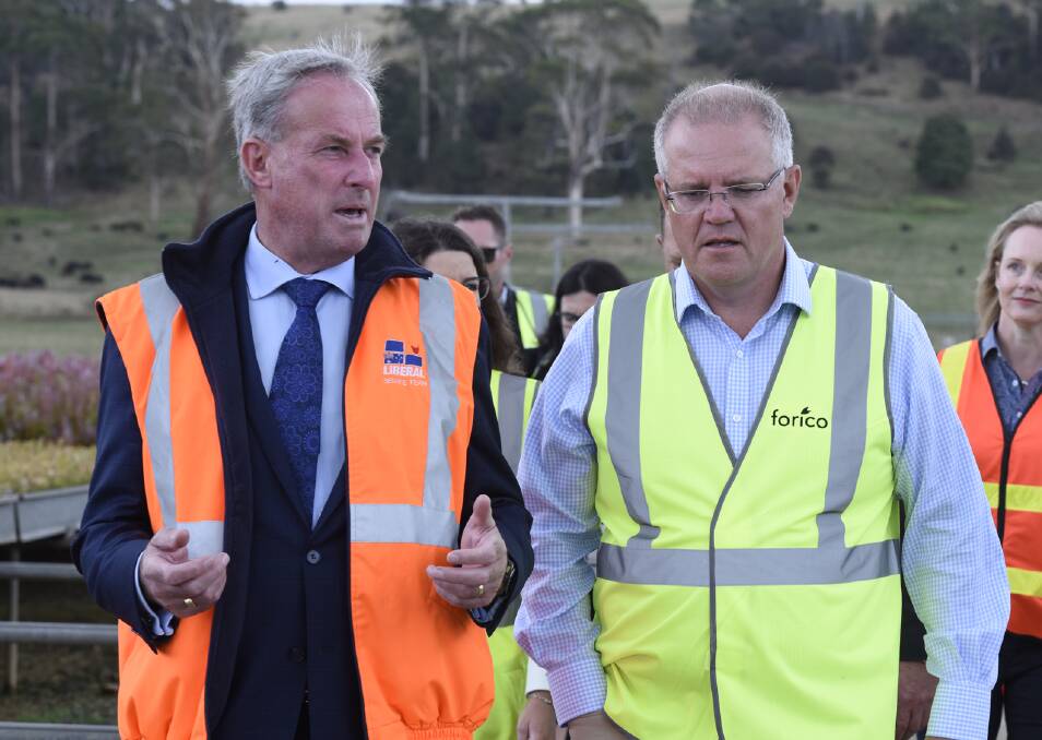 Sports Minister Richard Colbeck, left, says Prime Minister Scott Morrison's government has no plans to bail out the Mr Fluffy debt. Picture: AAP