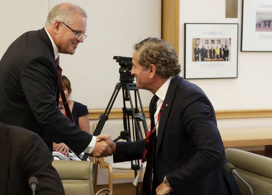Mark Bouris with Prime Minister Scott Morrison at a housing roundtable meeting earlier this year. Picture: Alex Ellinghausen