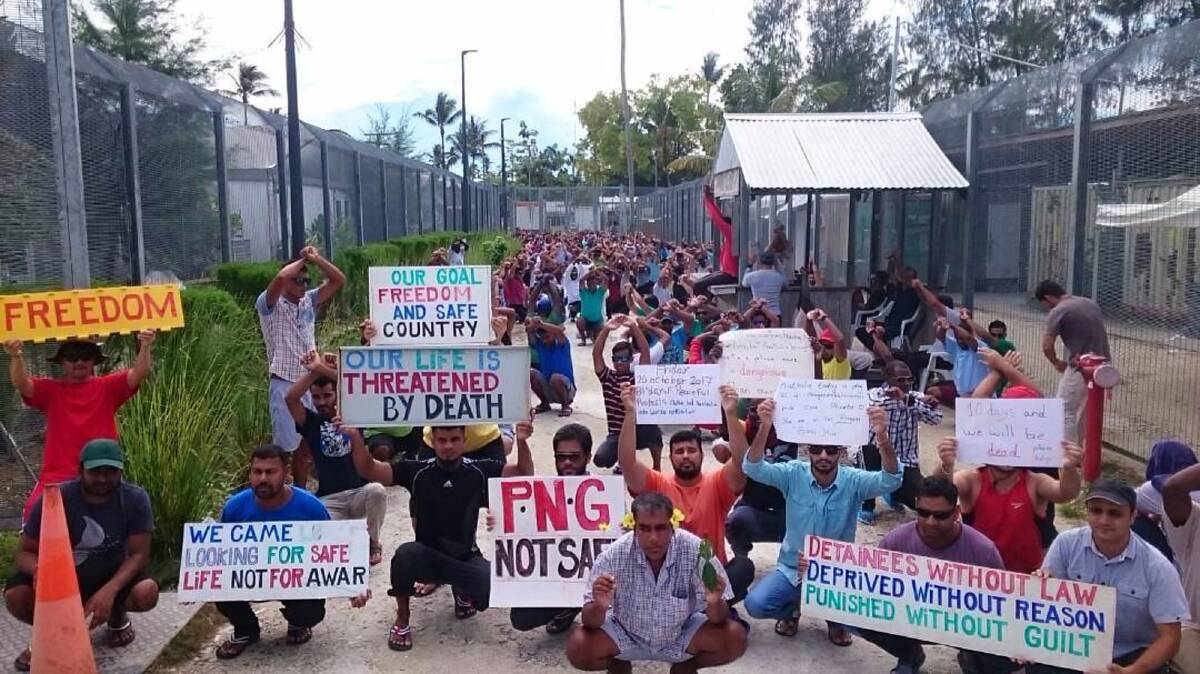 Refugees and asylum seekers hold up banners during a protest at the Manus Island immigration detention centre. The medevac law was passed to streamline the process for emergency medical evacuation of refugees from Manus Island and Nauru. Picture: Refugee Action Coalition