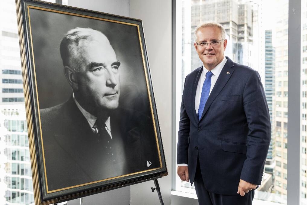 Prime Minister Scott Morrison with a portrait of Liberal Party pioneer Sir Robert Menzies on March 12. Photo: AAP Image/Daniel Pockett