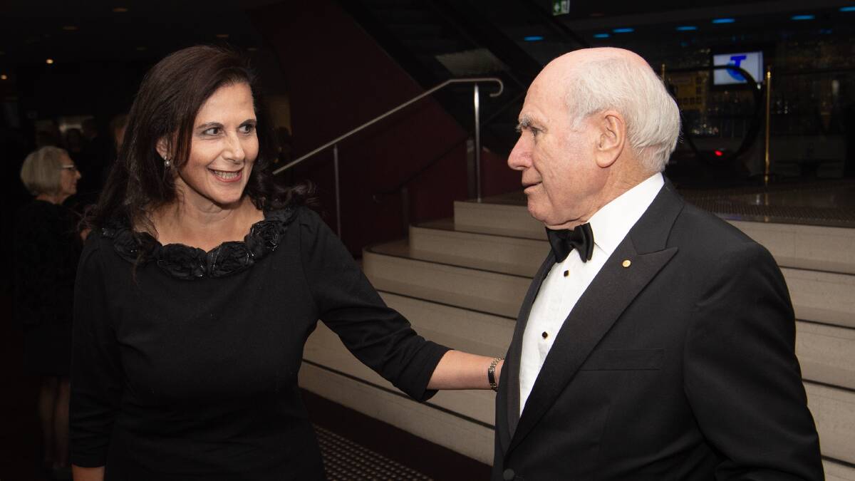 Concetta Fierravanti-Wells with John Howard this year. The senator bought 10 copies of the former prime minister's books of speeches recently. Picture: Wolter Peeters