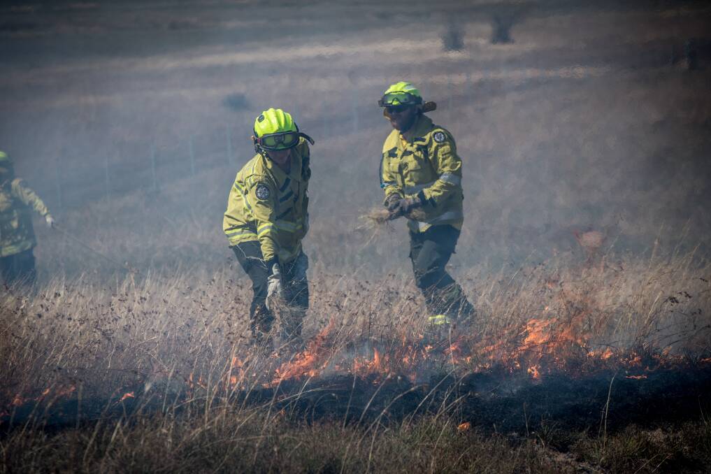ACT Parks and Conservation fire officers conduct a controlled burn in March to reduce fuel loads. File picture: Karleen Minney