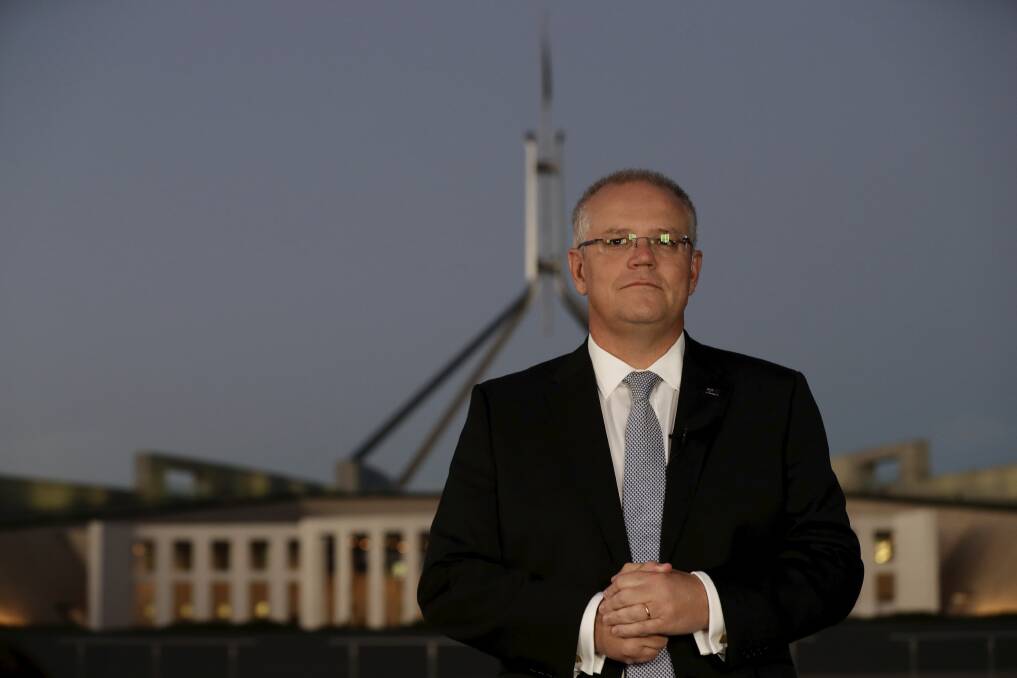 Prime Minister Scott Morrison during budget-sell interviews on the front lawn of Parliament House. Photo: Alex Ellinghausen