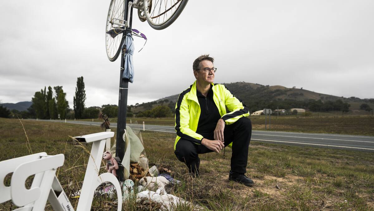 Pedal Power CEO Ian Ross at the memorial to killed cyclist Mike Hall on the Monaro Highway. Photo: Dion Georgopoulos