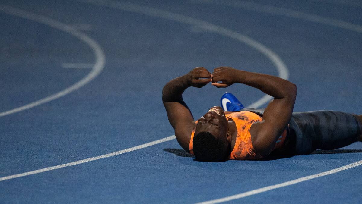 Edward Nketia reacts after claiming the Australian 100m championship. Photo: AAP Image/Steve Christo.