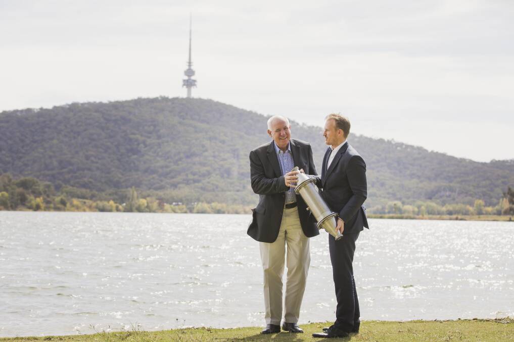 Nano Bubble Technologies founder Gary Stone (pictured left) and marketing director Steve Lewis (right) hold one of their unique "injectors" that could be containerised along Lake Burley Griffin. Photo: Jamila Toderas