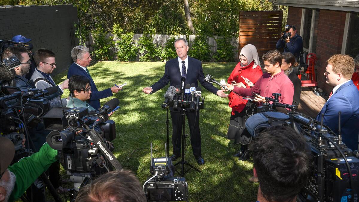 Opposition leader Bill Shorten, with Tanya Plibersek speaking at a press conference on the first day of the election campaign. Photo: Justin McManus.  