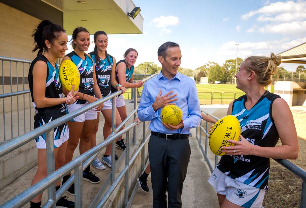 Belconnen Magpies women's and girls team membersm, from left, Jacqueline Spence, Summer McKay, Natasha McKay, Emily Pease, Ellie Hicks and Emma Zouch with federal member for Fraser Andrew Leigh at the Holt District Playing Fields on Friday. Photo: Elesa Kurtz