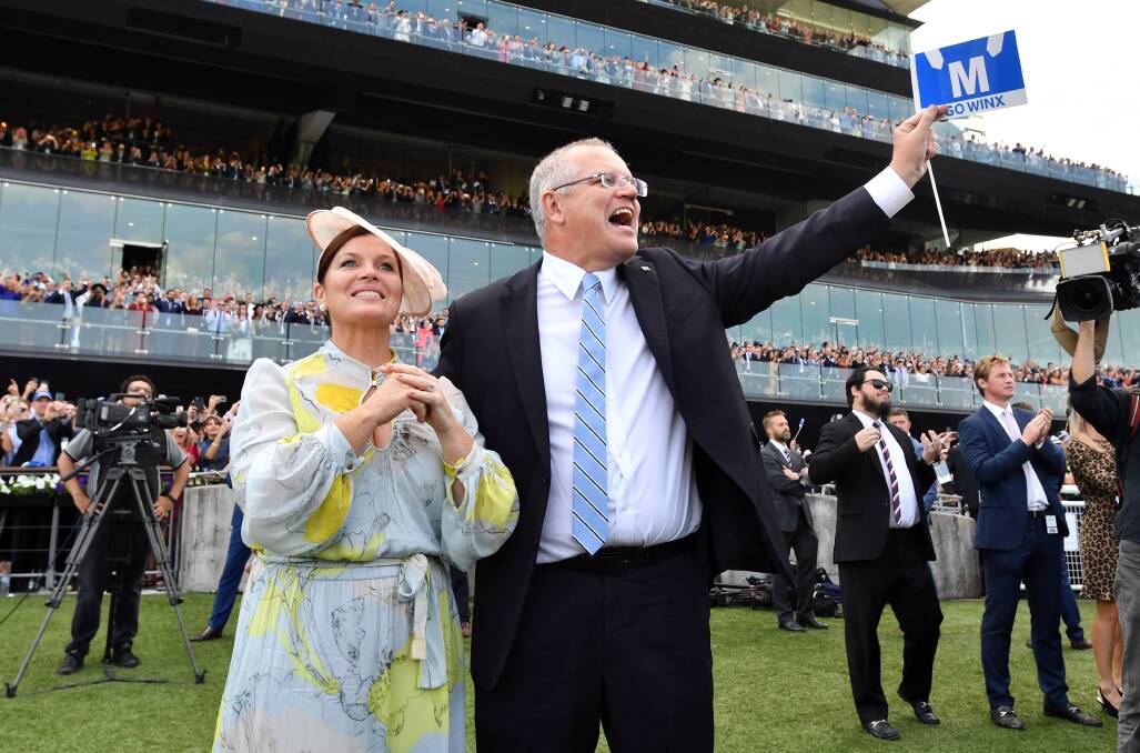 Prime Minister Scott Morrison and wife Jenny watch champion racehorse Winx win the Queen Elizabeth Stakes. Photo: Mick Tsikas