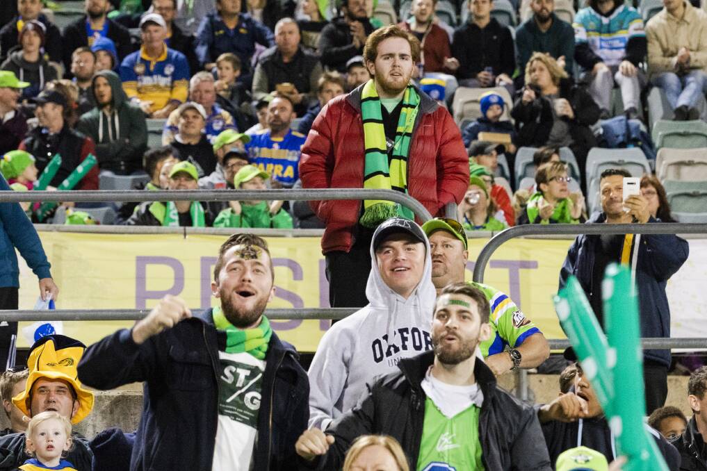 The Canberra Times reporter Jasper Lindell, standing in the crowd at first Canberra Raiders game, looks on in horror at the spectacle. Photo: Jamila Toderas