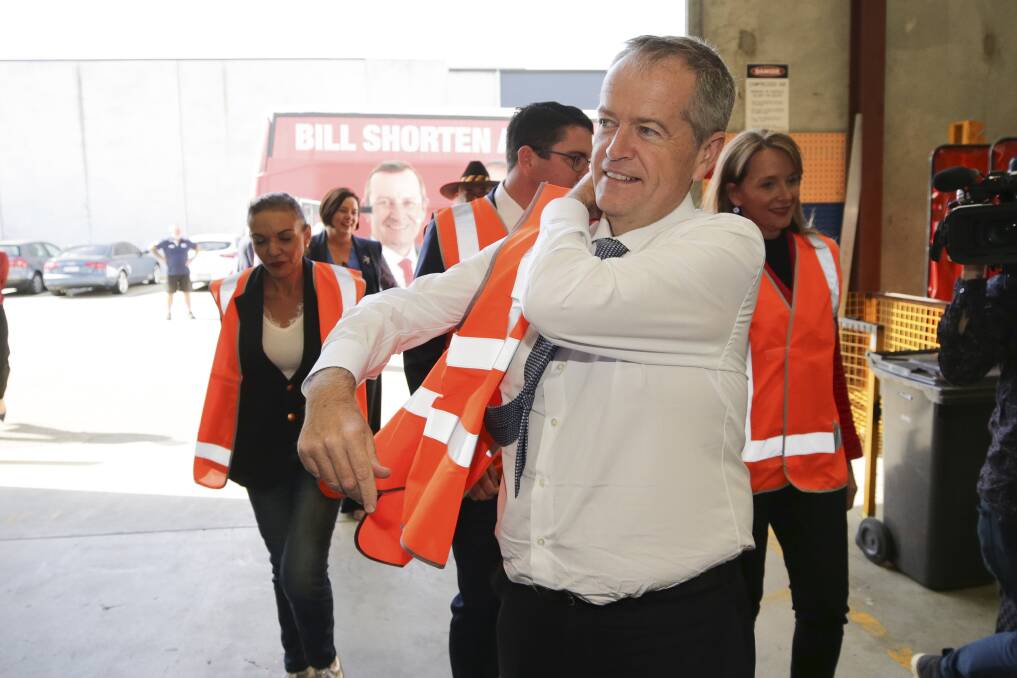 Opposition Leader Bill Shorten meets with workers at the Volgren bus facility in Perth on April 17, 2019. Photo: Alex Ellinghausen