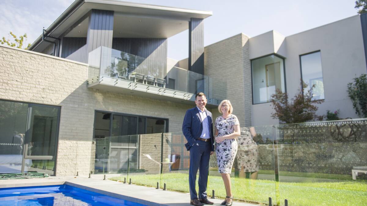 Real estate agents Rick and Tina Meir at a property in Buvelot Street, Weston, which has sold for a suburb-record price of $2.01 million. Photo: Dion Georgopoulos