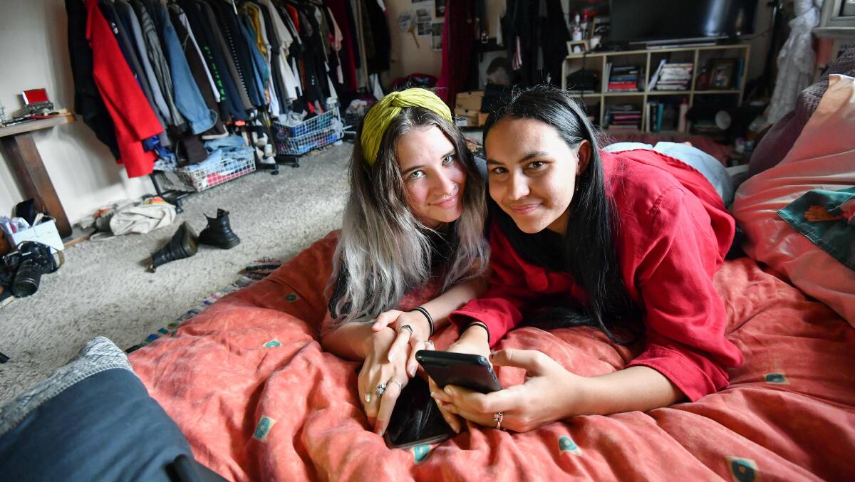 Halle Matthews and Stella-Rae Burns are co-tenants of a share house who save on rent by sharing their bedroom. Photo: Joe Armao