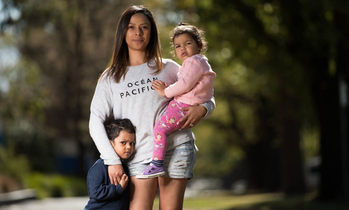 Valerie Jackson, with Talia, 3, and Chloe, 2, pays nearly her net weekly wage in childcare costs. Photo: Jason South