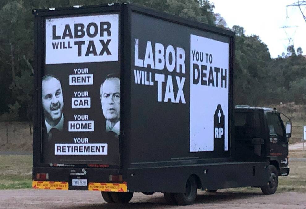 A truck spotted around the ACT displaying political advertisingreferring to Labor taxes - clearly authorised by the Liberal Party. Photo: Supplied