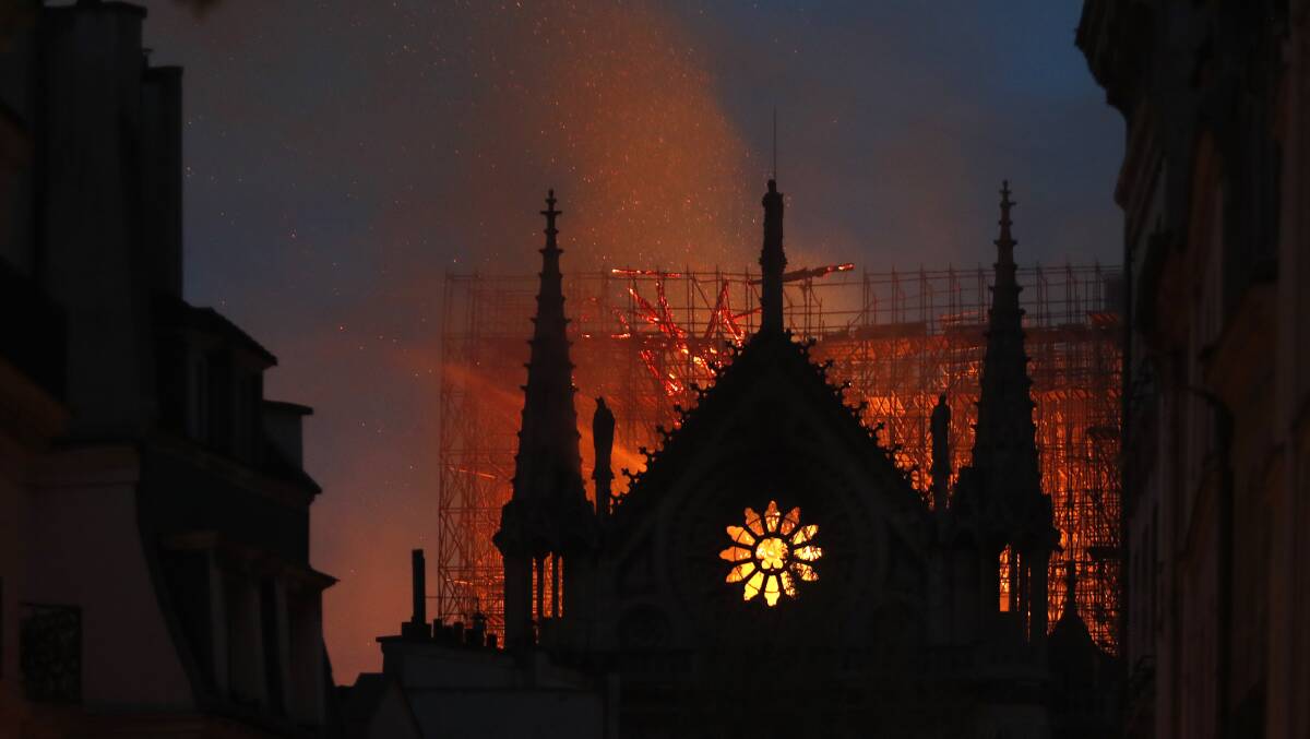 Flames and smoke rise from Notre Dame cathedral in Paris on Monday, April 15. Photo: AP