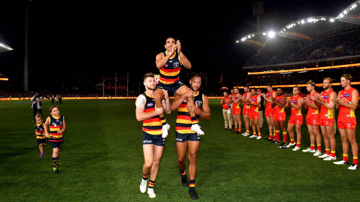 Eddie Betts, of the Adelaide Crows, is carried from the field after his 300th game on Sunday. Photo: AAP