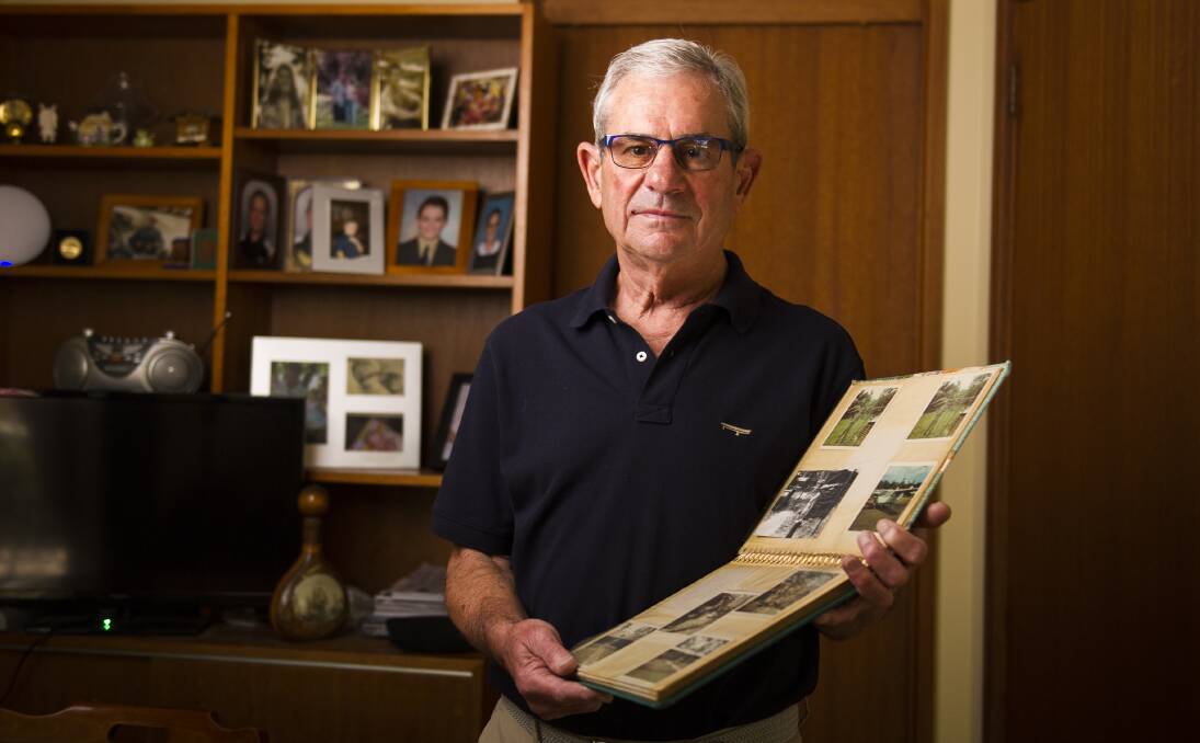 Vietnam veteran, Greg Kennett, with an album of his time during the war. Photo: Dion Georgopoulos