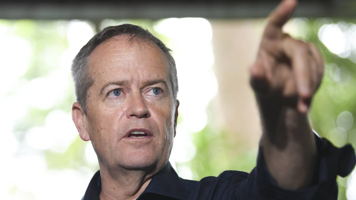 Opposition Leader Bill Shorten speaks to the media in Cairns on Monday. Photo: AAP Image/Lukas Coch