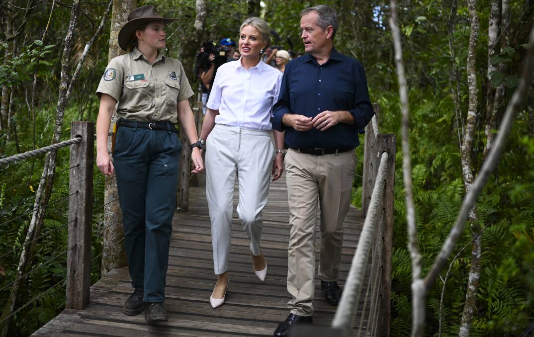 Australian Opposition Leader Bill Shorten and his wife Chloe speak to a ranger as they walk through the Skysail rainforest cableway in Cairns. Photo: AAP
