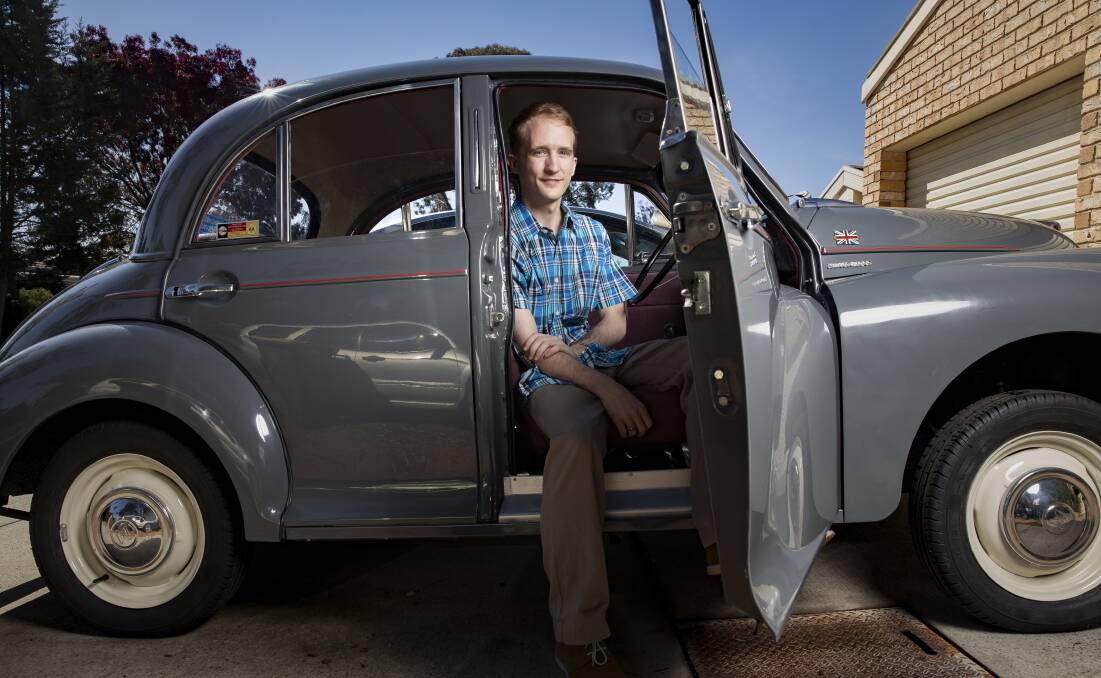 Nathan Hall with his well-travelled Morris Minor. Photo: Sitthixay Ditthavong