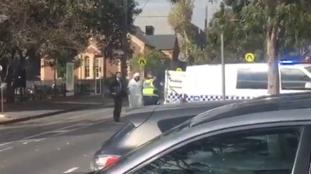 Police have arrested a man near St Mary's church in North Melbourne. Photo: Nine News