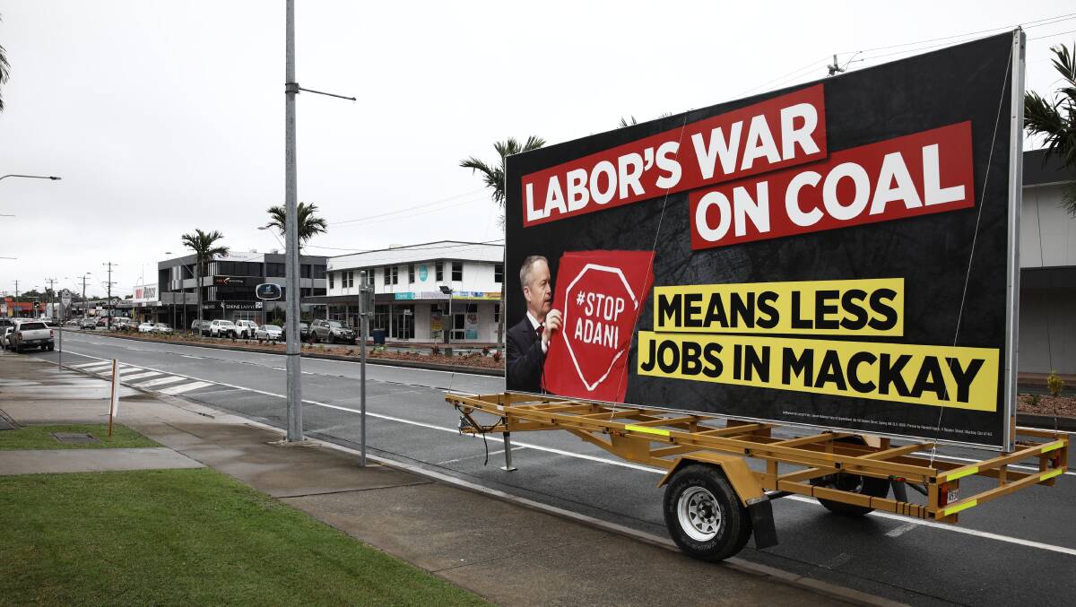 A billboard parked at the pro-Adani rally in Mackay featured a misleading, cropped photograph of Bill Shorten. Photo: Dominic Lorrimer
