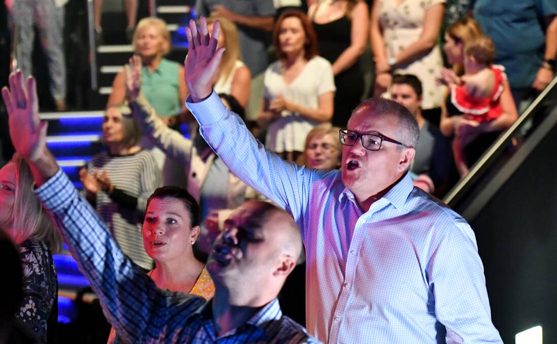 Scott Morrison sings during an Easter Sunday service at his Horizon Church at Sutherland. Picture: AAP