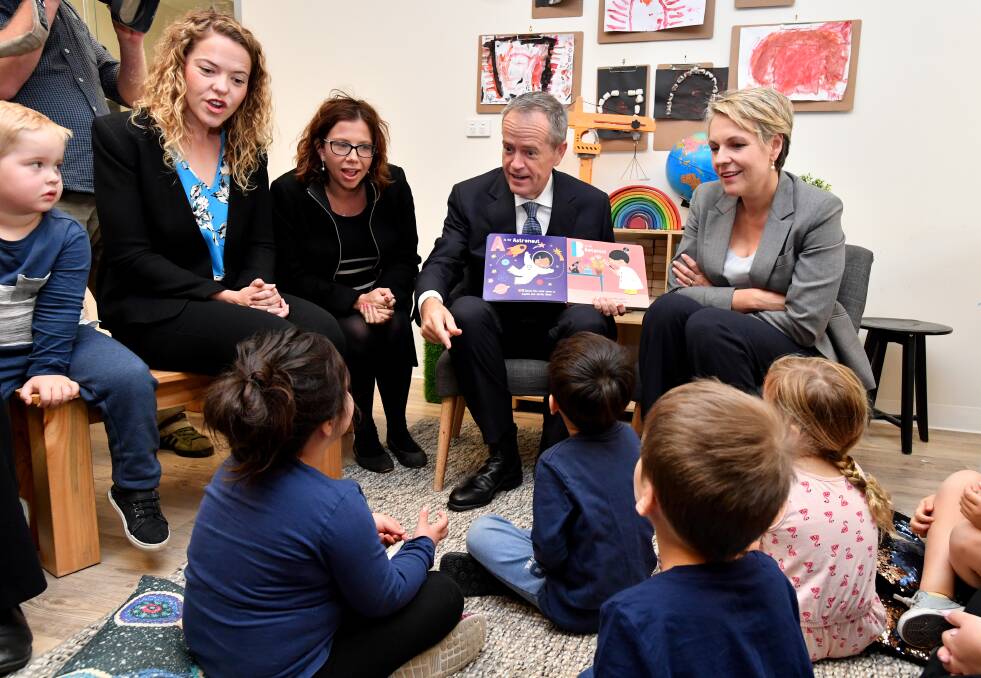 Opposition Leader Bill Shorten and Deputy Opposition Leader Tanya Plibersek (right) at a childcare centre. Picture: AAP Image/Darren England