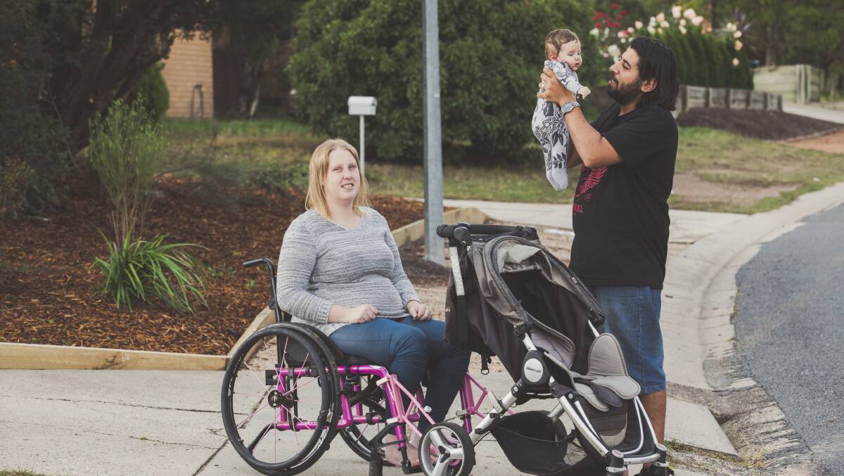 Franciine Rowland-Mahmoud and her husband Mahmound Abouhamza and their baby Ali. TADACT created arms that connect her wheelchair to the pram.
Picture: Jamila Toderas