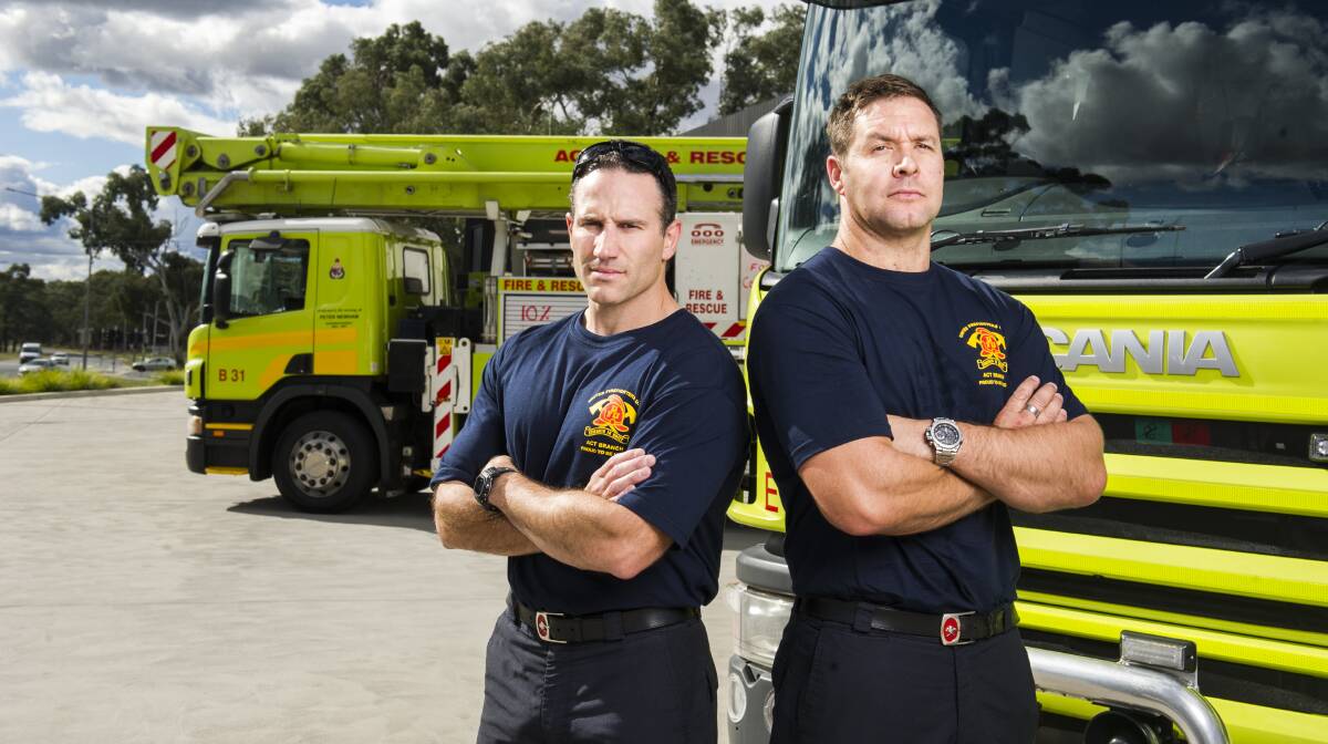 Station officer Damian Holloway and senior firefighter Nick Louis outside the Belconnen Fire and Ambulance Station. Picture: Dion Georgopoulos