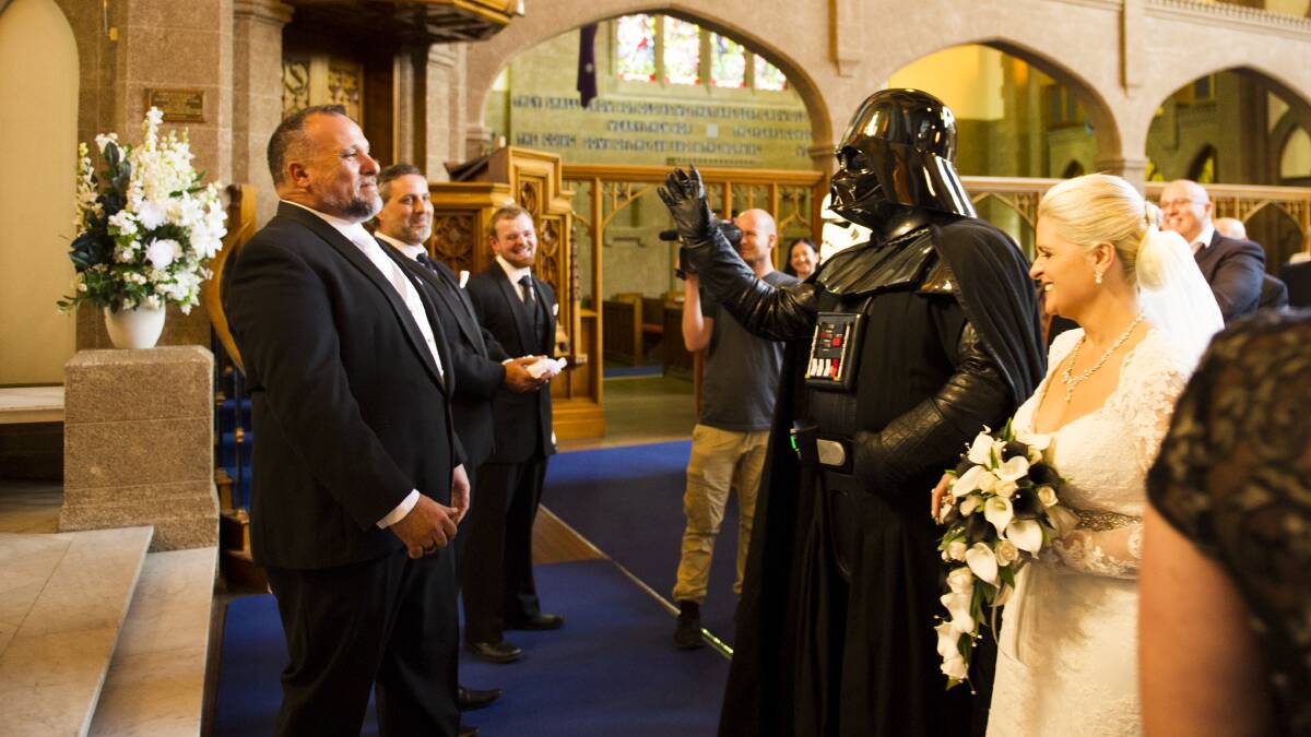 Darth Vader uses the Force on groom Antonio Krajina at the altar, after walking bride Sonya Catterall down the aisle. Picture: Dion Georgopoulos
