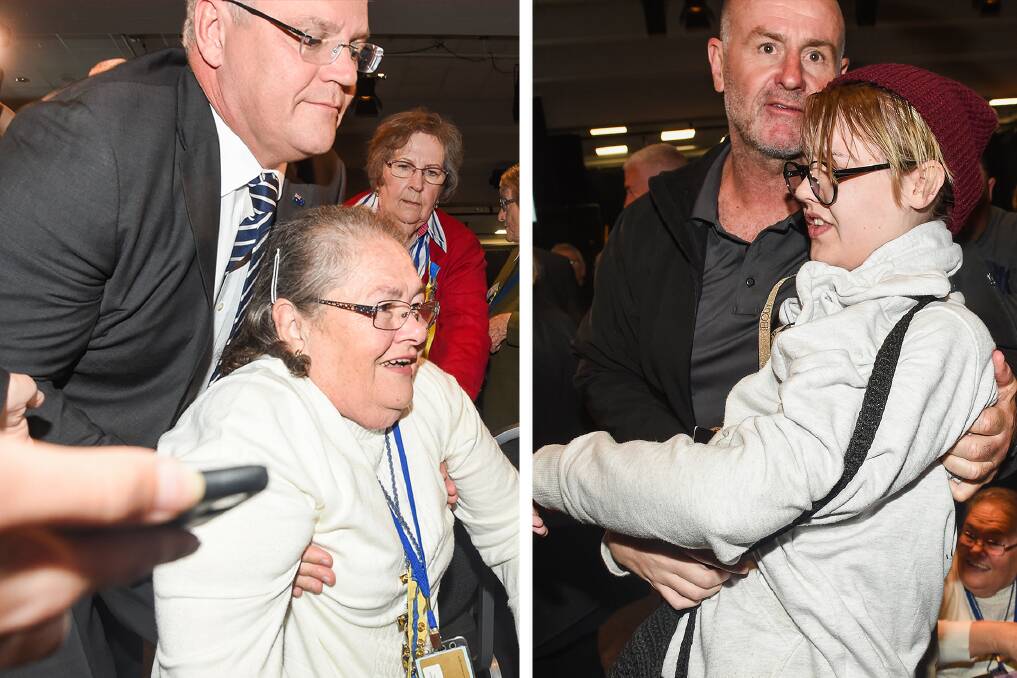 Scott Morrison helps an older woman after she was knocked over in the aftermath of a protester throwing an egg at him at a CWA event in Albury. The young woman was escorted out. Pictures: Mark Jesser