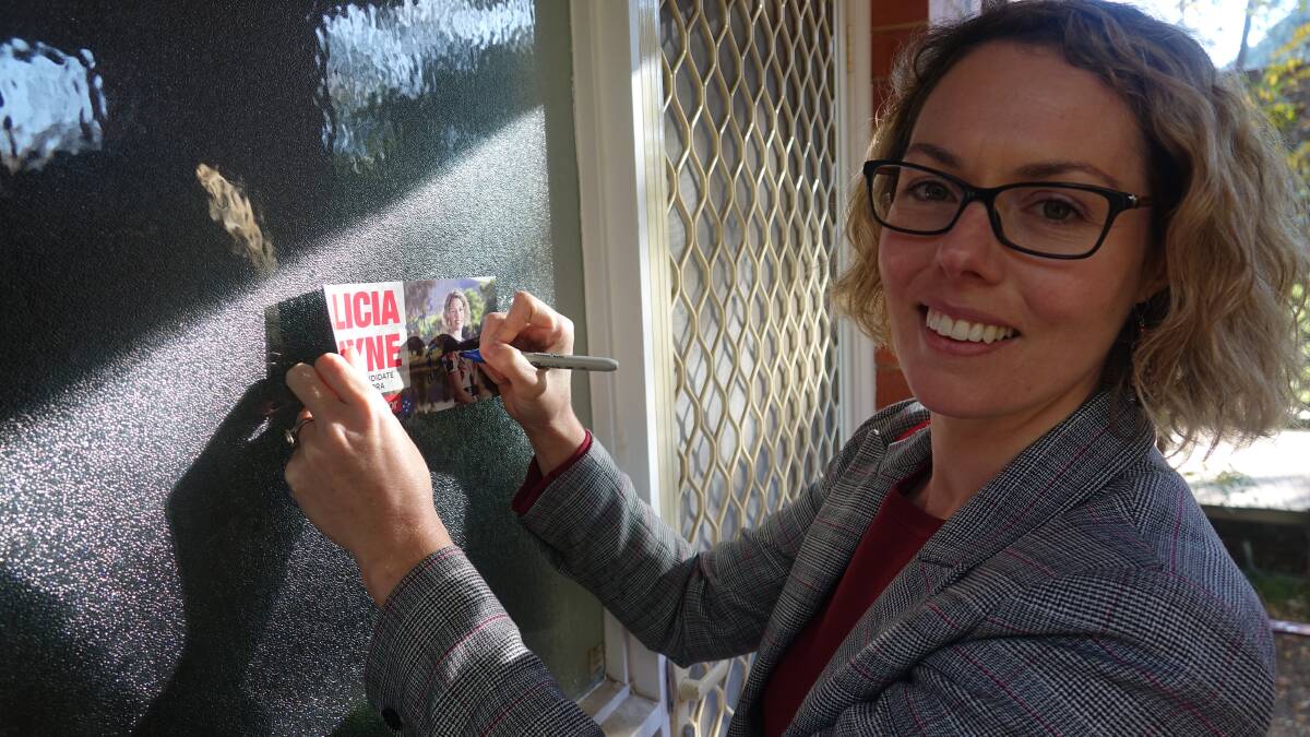 Nobody home. Labor's Alicia Payne leaves a leaflet. Picture: Steve Evans.