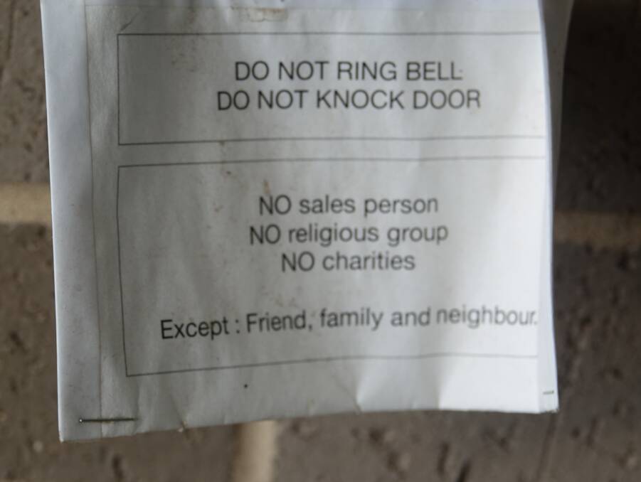 A warning to door-knockers in Downer. "Except: Friend, family and neighbour."