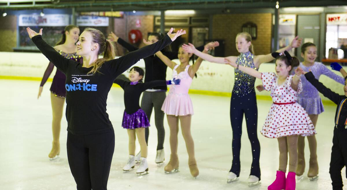 Disney On Ice skater Anna Bradshaw teaches kids some dance moves from the show. Picture: Dion Georgopoulos