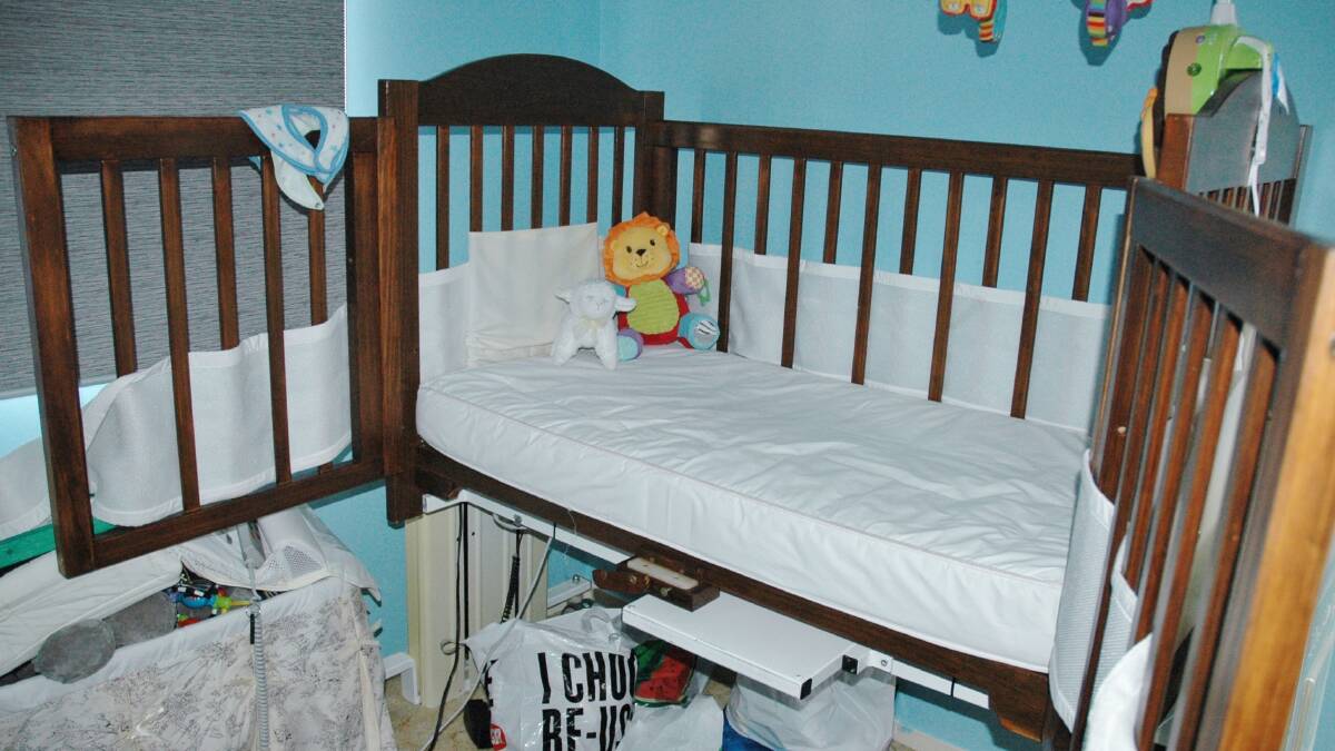 Ali's cot which was modified by TADACT to include barn-like doors so his mum Francine Rowland-Mahmoud can get in close with her wheelchair.
