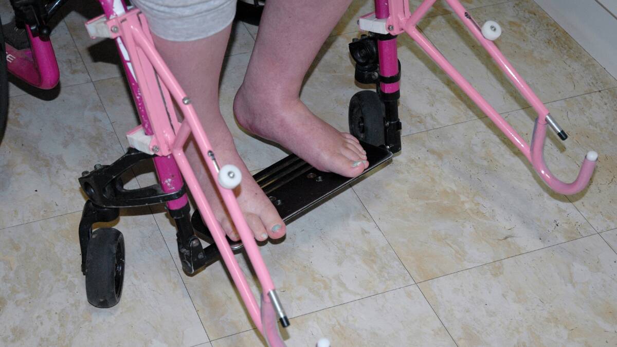 TADACT added arms to the wheelchair so it could connect to the pram so Francine Rowland-Mahmoud could push her own baby.