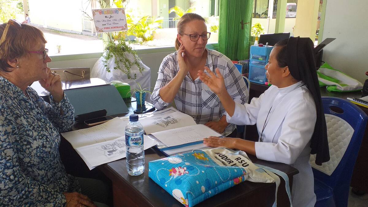 Sue-Ann O'Rourke (middle) meeting with Sir Bernadette to discuss plans to double the size of the maternity hospital in West Timor. Picture: Supplied