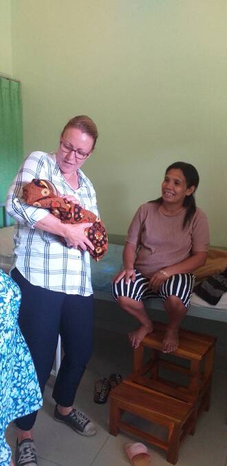 Sue-Ann O'Rourke holding one of the sponsored babies at the Mother Ignacia Hospital in West Timor, Indonesia. Picture: Supplied