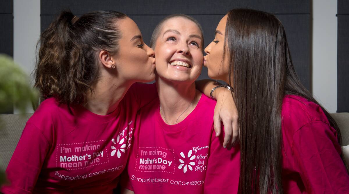 Anne Macafee (centre), who is celebrating the end of 225 days of chemotherapy to treat breast cancer, is running the Mother's Day Classic with her daughters Laura (left) and Caitlin (right) to raise money for research into the disease. Picture: Elesa Kurtz