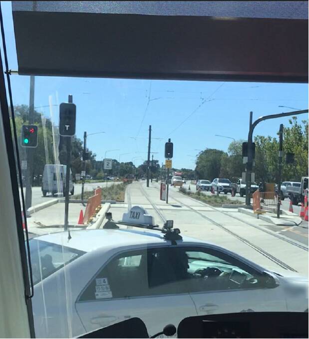 A taxi almost getting hit by the light rail on Northbourne Avenue during testing. Picture: Supplied