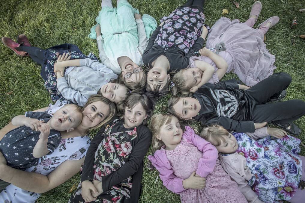 Claire Hooker with children- Michael, 1, Martina, 2, Rose, 4, Catherine, 6, Elizabeth, 6, Abigail, 7, Franchesca, 8, Charlotte, 9 and Georgina, 10. Picture: Karleen Minney.