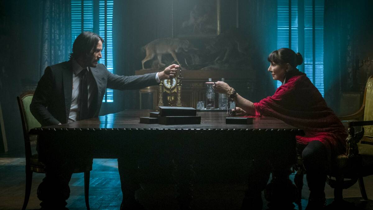 Keanu Reeves, left, and Anjelica Huston in a quieter scene from John Wick: Chapter 3 - Parabellum. Picture: Niko Tavernise/Lionsgate via AP